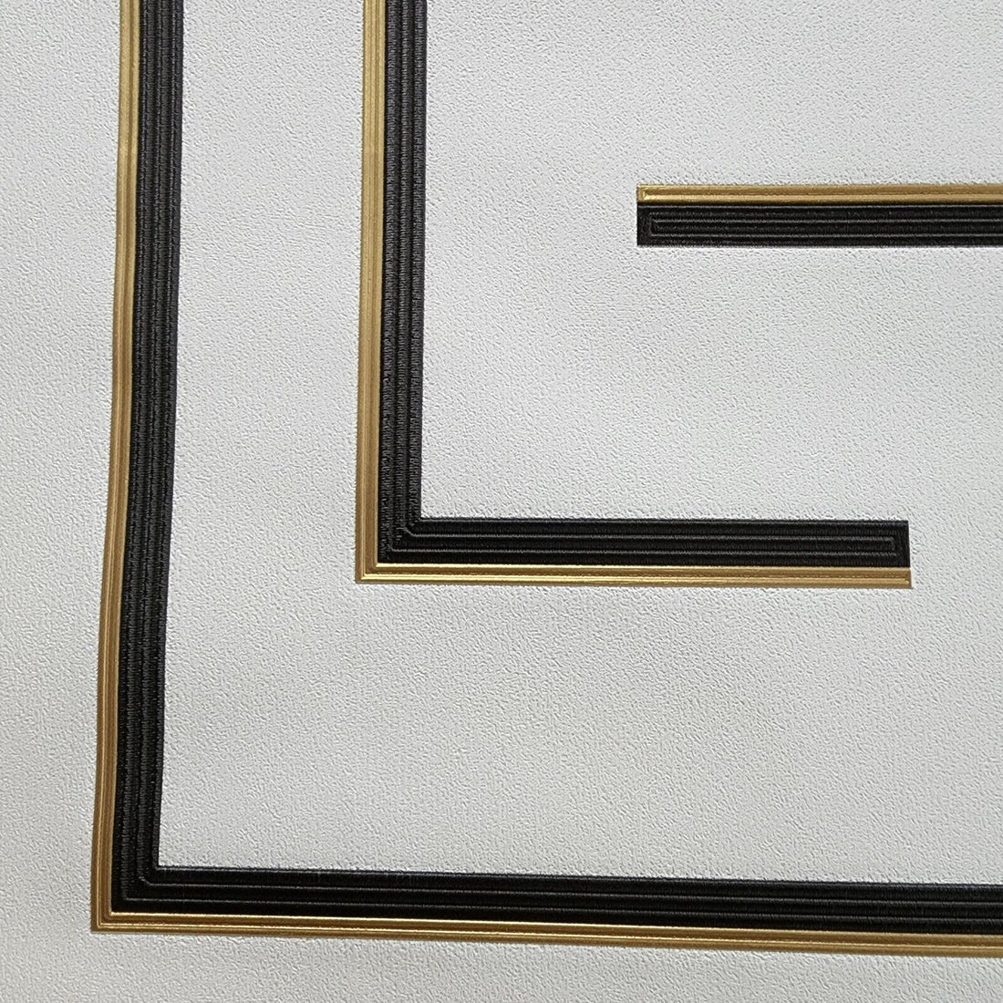 Decorative wallpaper with geometric patterns on a light background