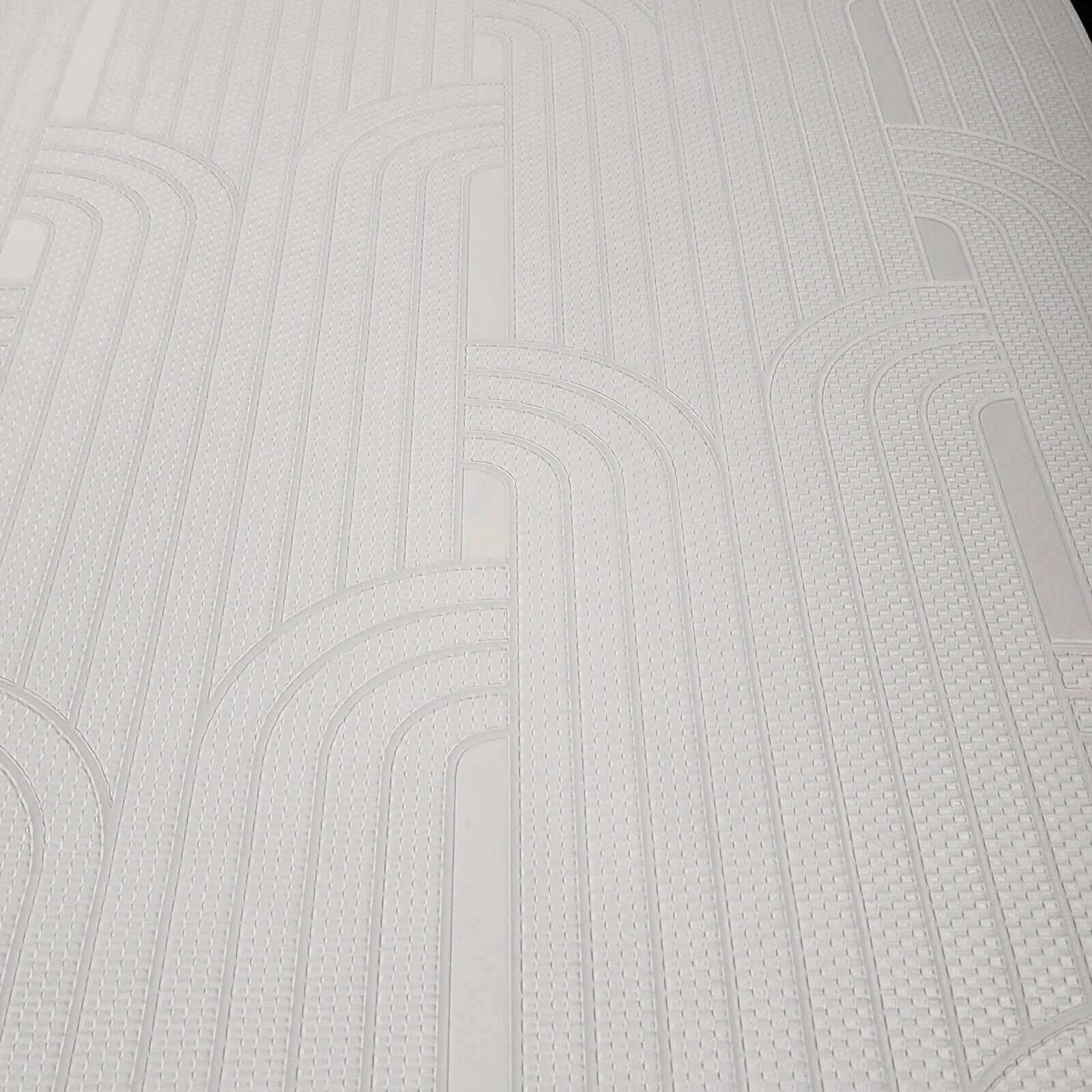 Close-up of a textured cream wallpaper with wavy lines