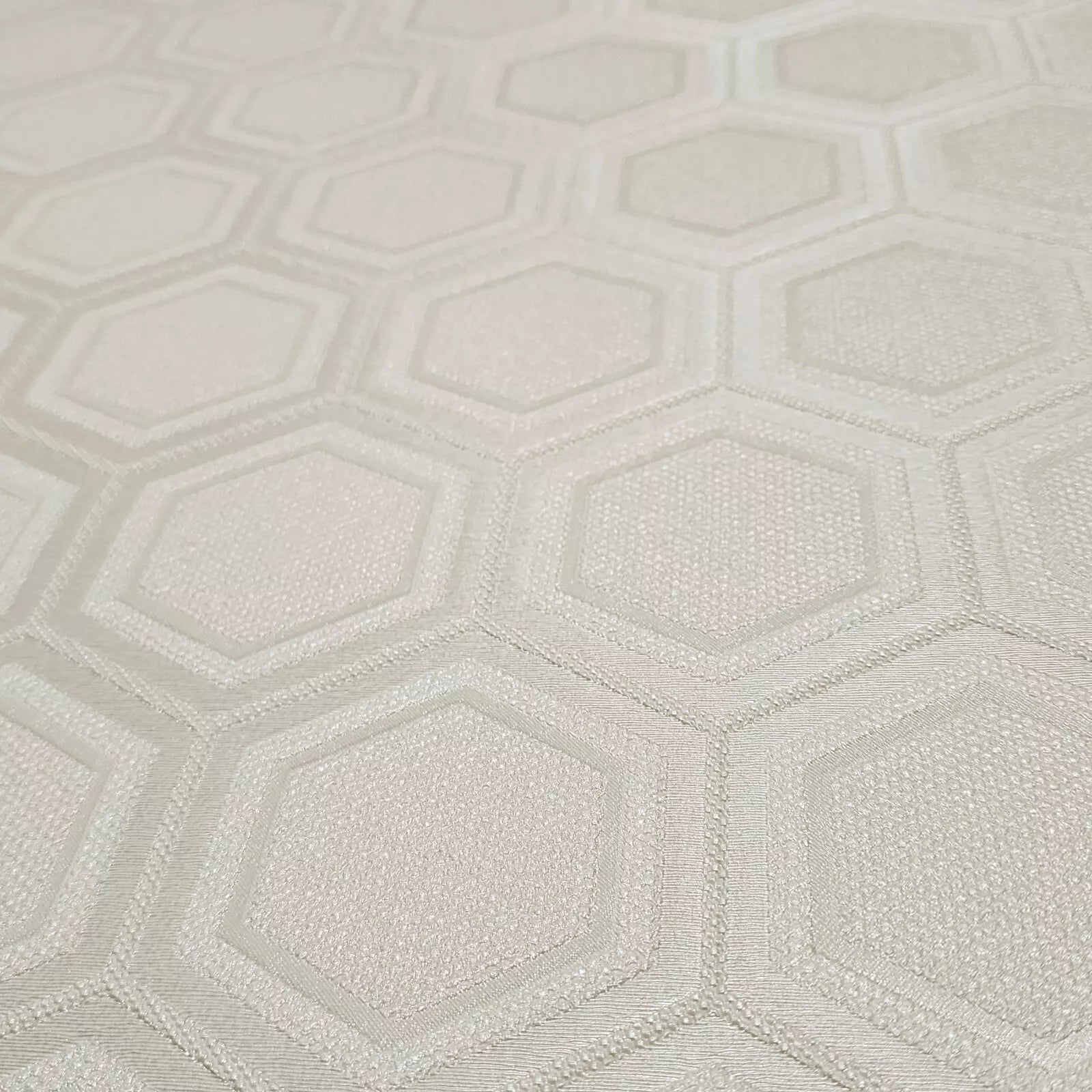Textured wallpaper with a geometric hexagonal pattern in light gray.