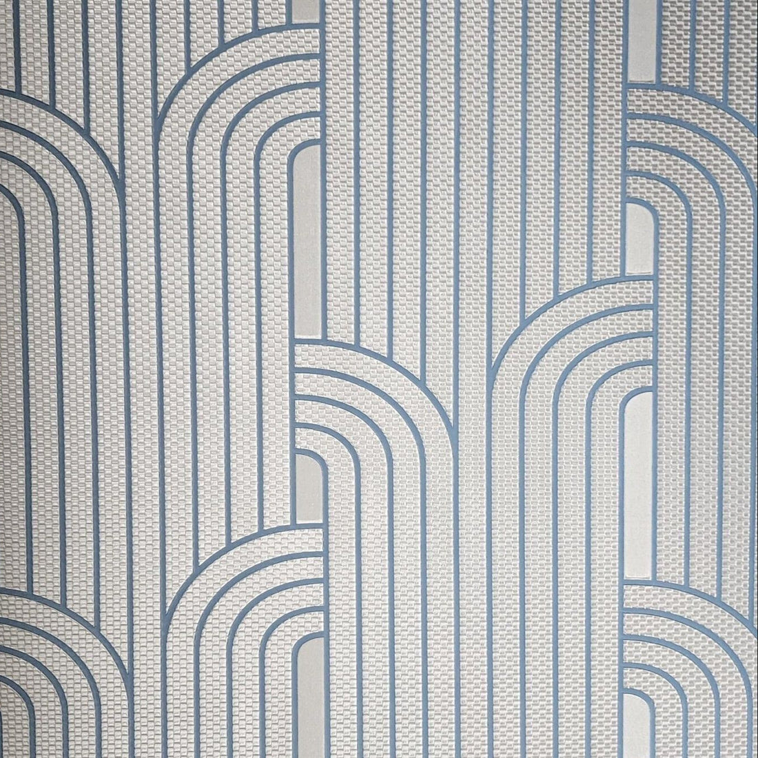 Patterned wallpaper with geometric design in blue and gray