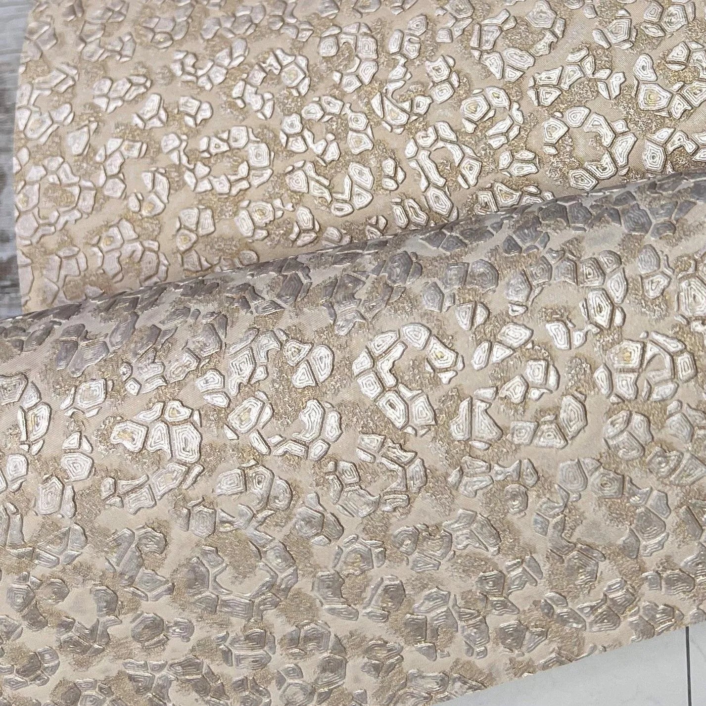 Wallpaper installed in a room showing its full pattern, color