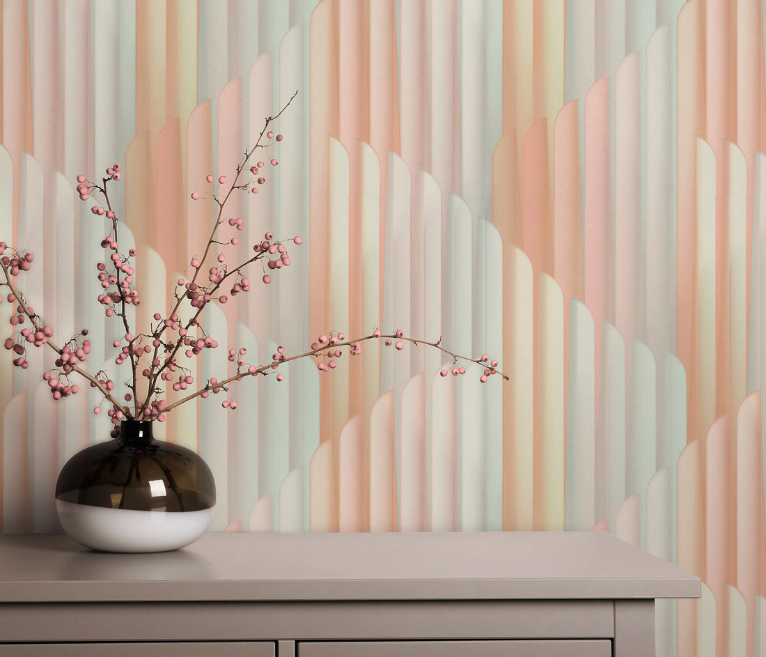 Erismann Elysium abstract geometric wallpaper featuring layered vertical arches in soft blush pink, muted sage green and warm beige tones, creating a modern Art Deco inspired design with a gentle pastel aesthetic.