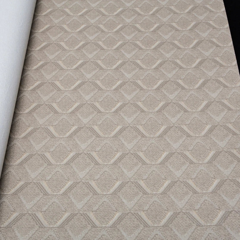 Textured wallpaper with geometric pattern and visible brand name on a black background