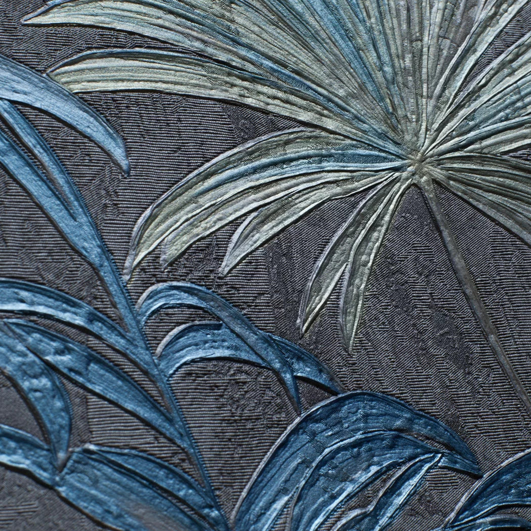 Close-up of tropical leaf pattern on a textured fabric background