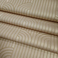 Textured wallpaper rolls with wavy line pattern in beige tones