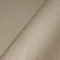 Close-up of textured beige wallpaper with geometric pattern